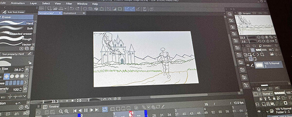 A laptop screen displays a Photoshop workspace with animation sketch of a castle and a dragon.