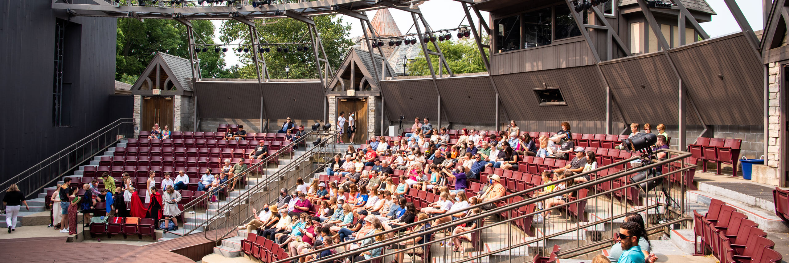 A crowd sits in the ampitheatre at Ewing Manor.