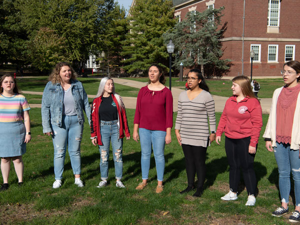 The Belle Voix choir performs on the quad.