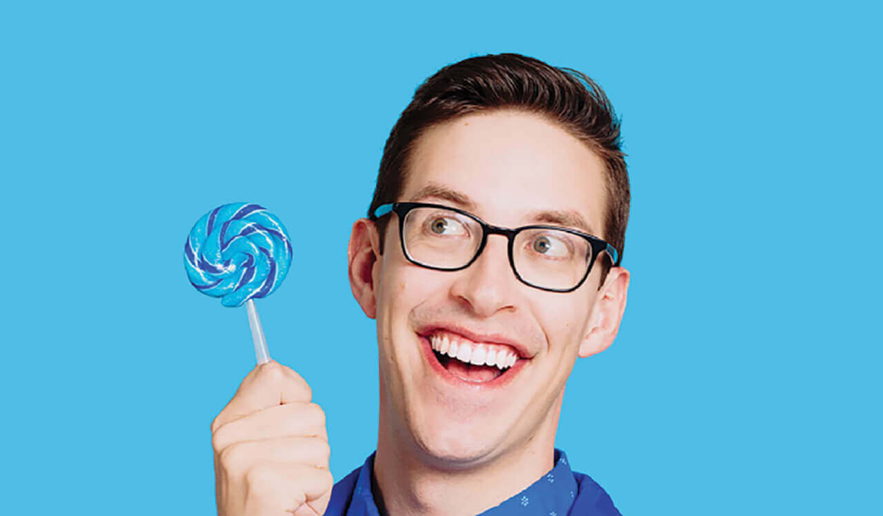 Keith Habersberger holding a lollipop.