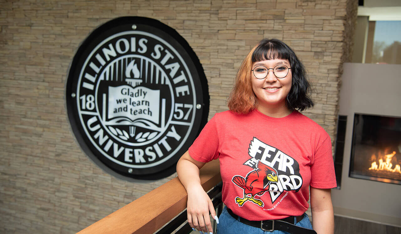 Olivia Meitz on the Bone Student Center wearing the 2021 Fear the Bird shirt.